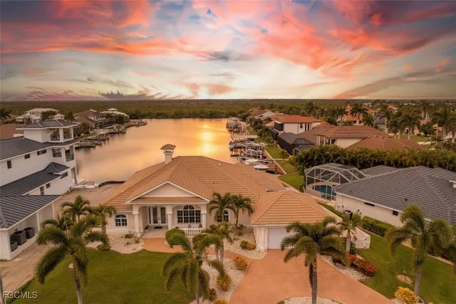 a living room with furniture and a kitchen area