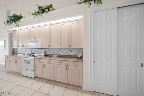 a bedroom with a bed and ceiling fan