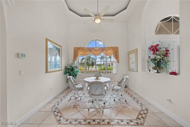 a very nice looking room with a large window table and chairs