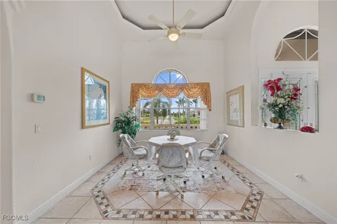 a bathroom with a tub a sink and a large mirror