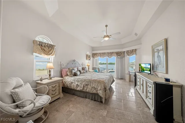 a bedroom with a bed and ceiling fan