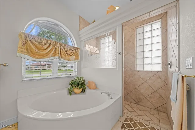 a white bath tub sitting in a bathroom