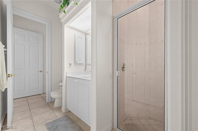 a bathroom with a shower and a sink