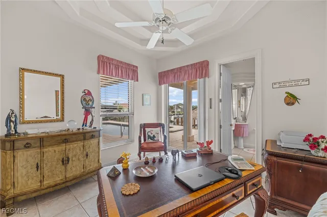 a living room with furniture and next to a window