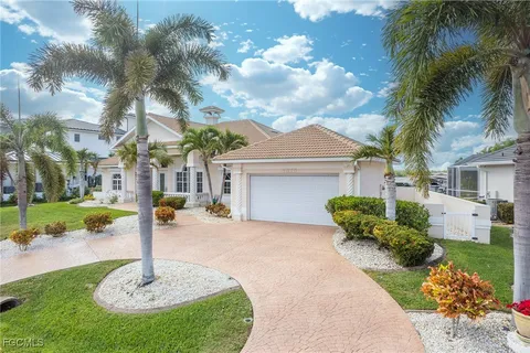 a living room with furniture and a kitchen area