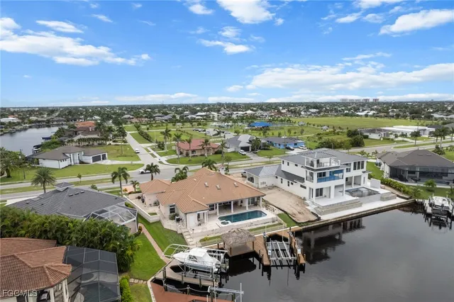 an aerial view of residential houses with outdoor space
