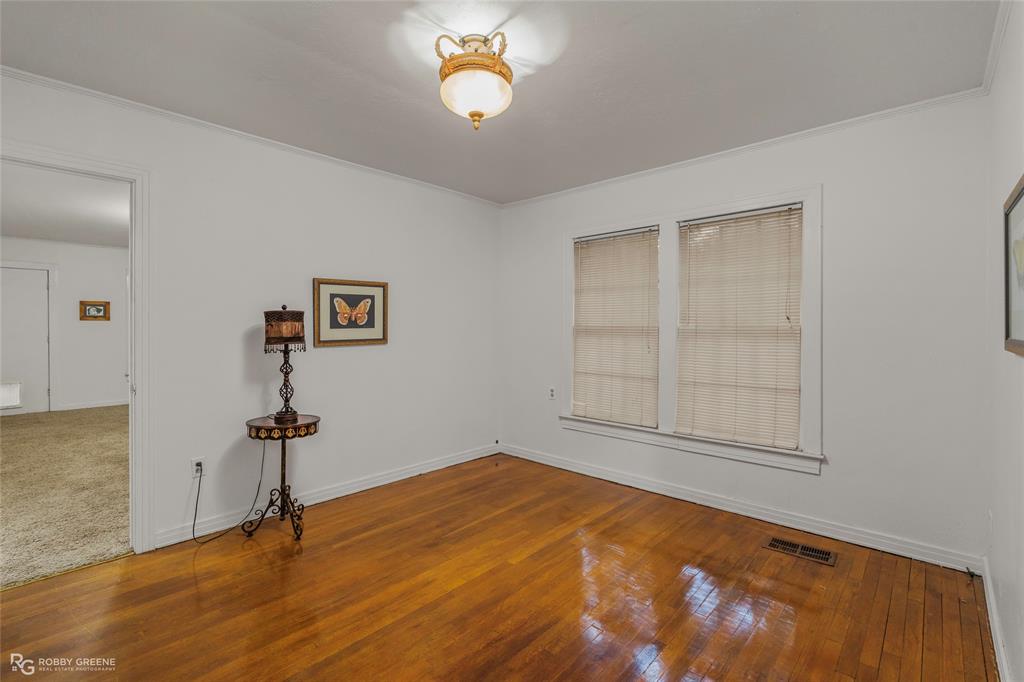 515 Davis Street Minden, LA 71055 - Photo 16 of 28 wooden floor in an empty room