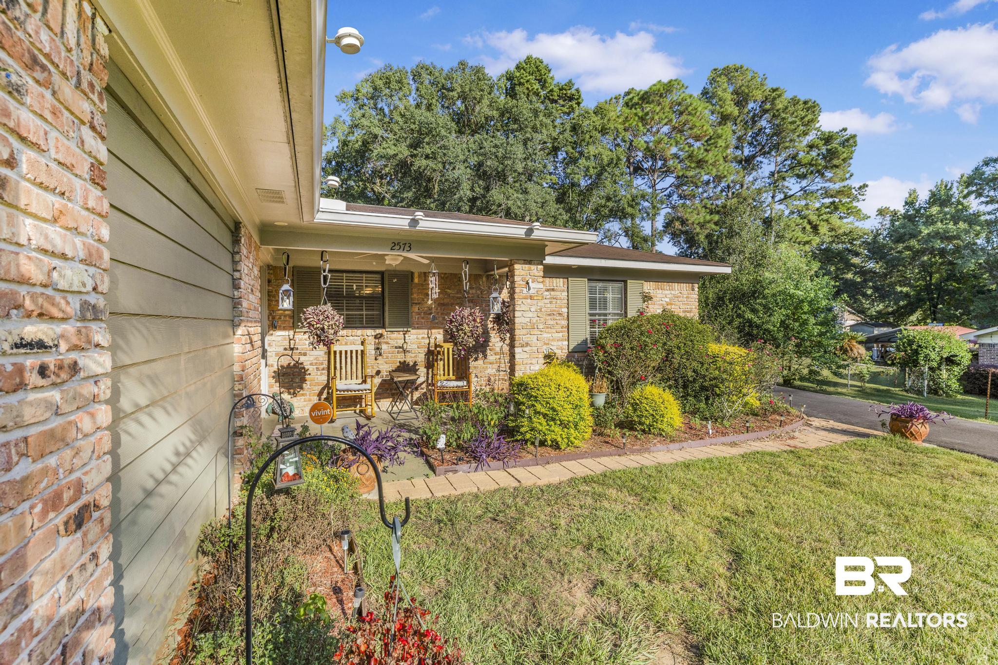 2573 E Road Mobile, AL 36693 - Photo 34 of 45 View of side of property featuring a lawn and brick siding