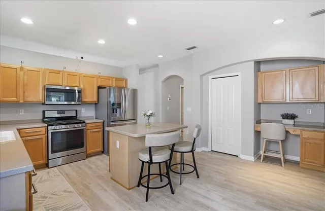 a workspace with furniture and wooden floor