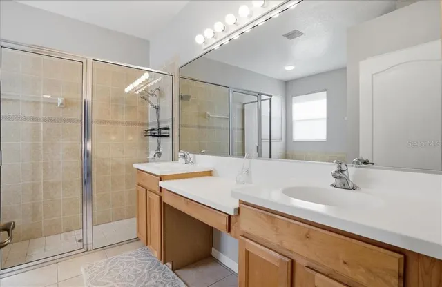 an aerial view of a house with a backyard