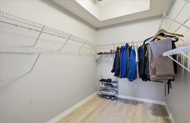 a aerial view of a house with a yard and lake view