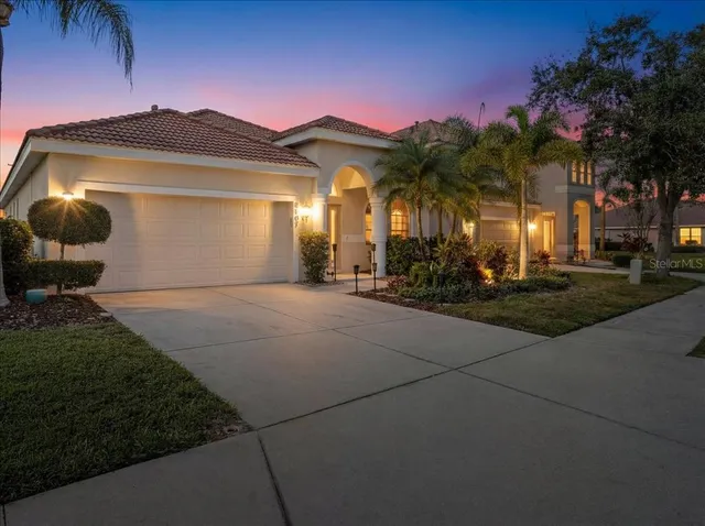 a dining room with furniture a clock and a large window