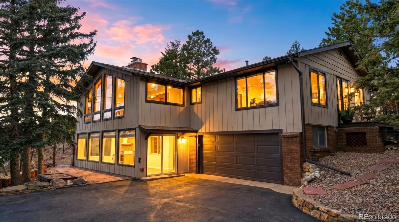 3155 Chestnut Circle Evergreen, CO 80439 - Photo 1 of 50 a front view of a house