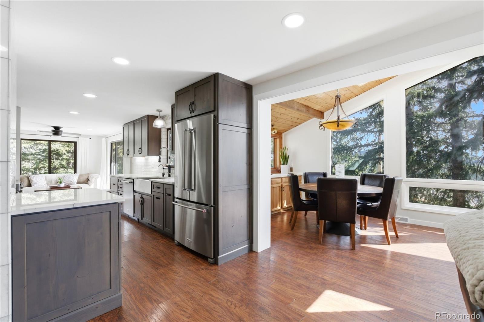 3155 Chestnut Circle Evergreen, CO 80439 - Photo 12 of 50 a kitchen with a table and chairs