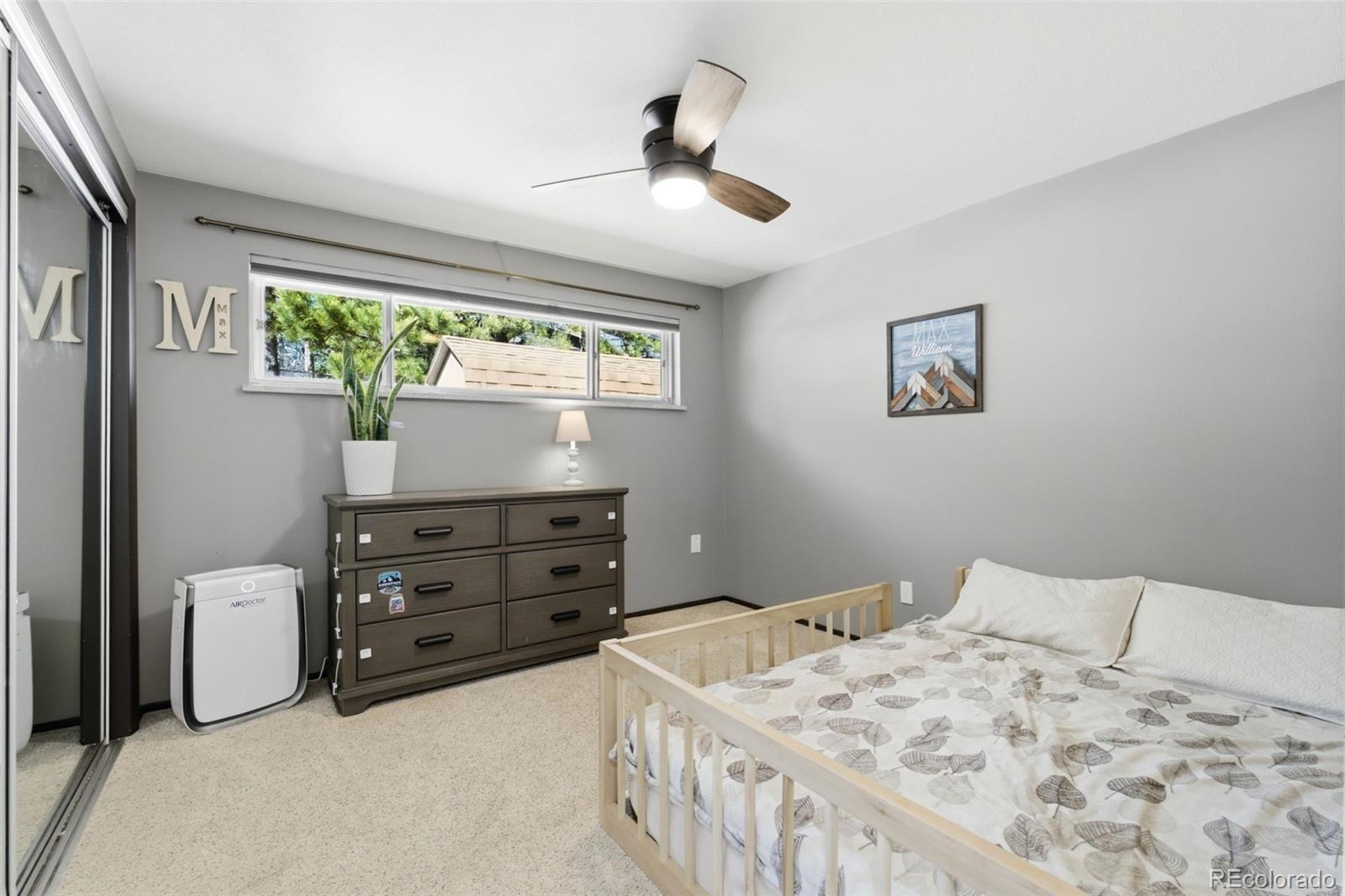 3155 Chestnut Circle Evergreen, CO 80439 - Photo 25 of 50 a bedroom with a bed and a window