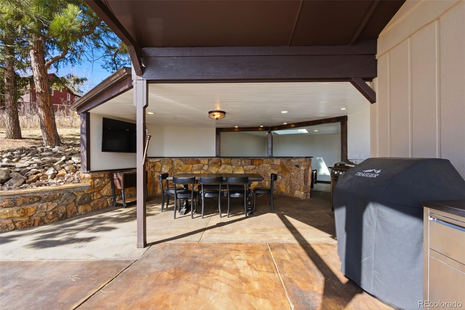 3155 Chestnut Circle Evergreen, CO 80439 - Photo 31 of 50 a view of a building with a patio