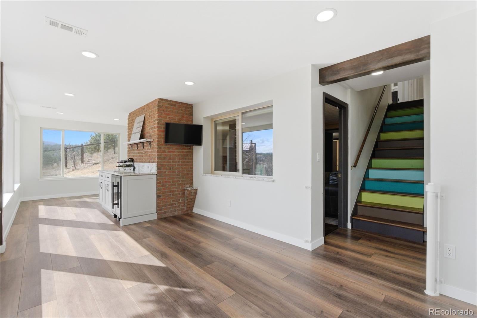 3155 Chestnut Circle Evergreen, CO 80439 - Photo 36 of 50 a view of a kitchen with furniture and staircase
