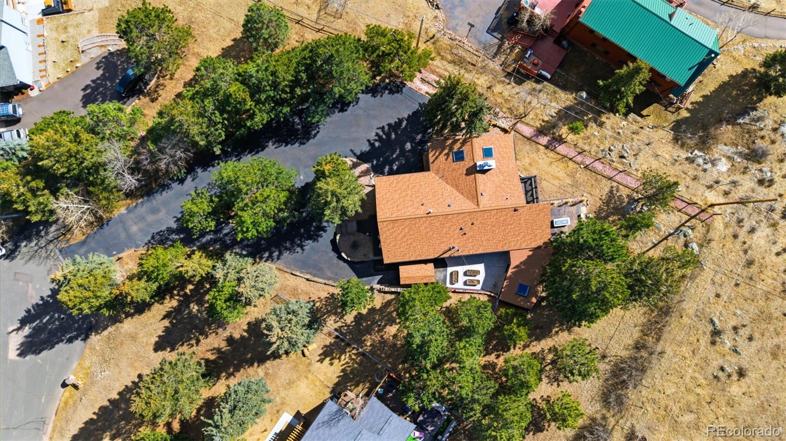 3155 Chestnut Circle Evergreen, CO 80439 - Photo 46 of 50 an aerial view of a house with a yard