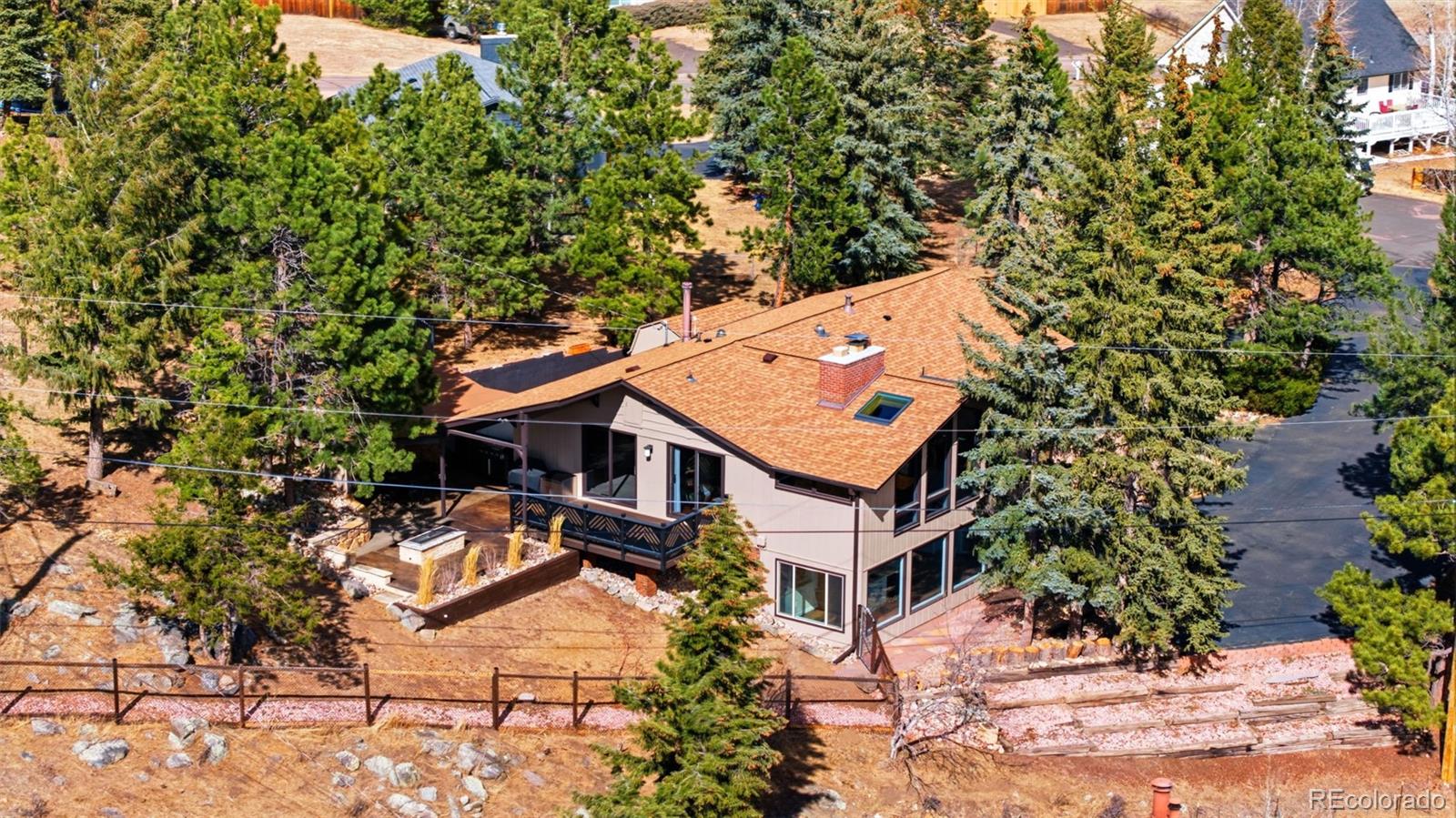 3155 Chestnut Circle Evergreen, CO 80439 - Photo 47 of 50 an aerial view of a house with a yard and sitting area