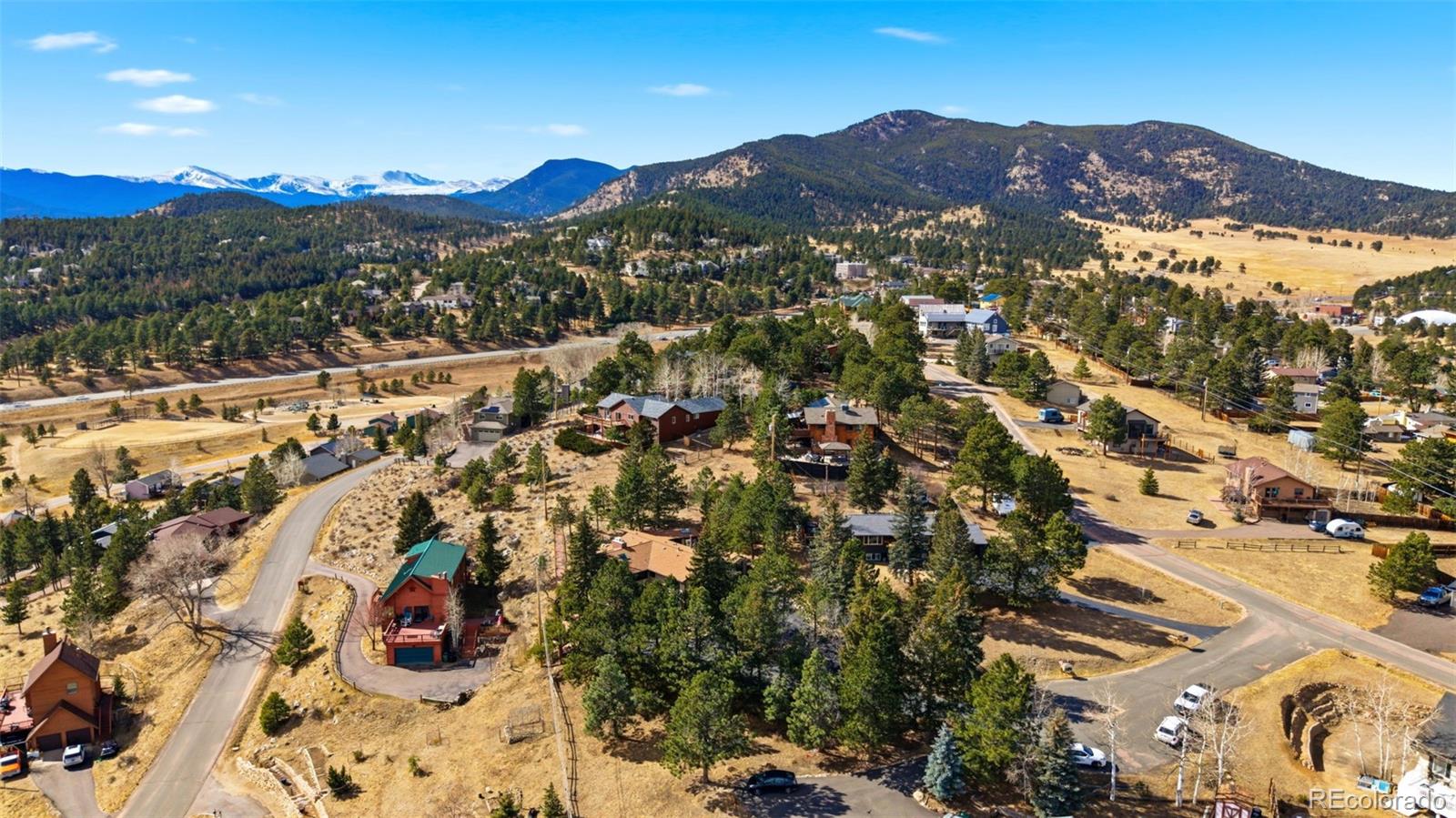 3155 Chestnut Circle Evergreen, CO 80439 - Photo 48 of 50 a view of a city with mountains in the background