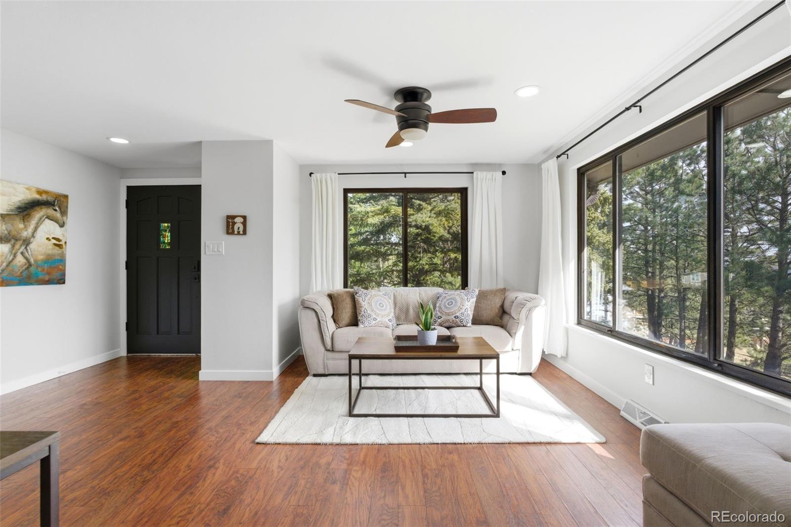 3155 Chestnut Circle Evergreen, CO 80439 - Photo 5 of 50 a living room with furniture and a large window