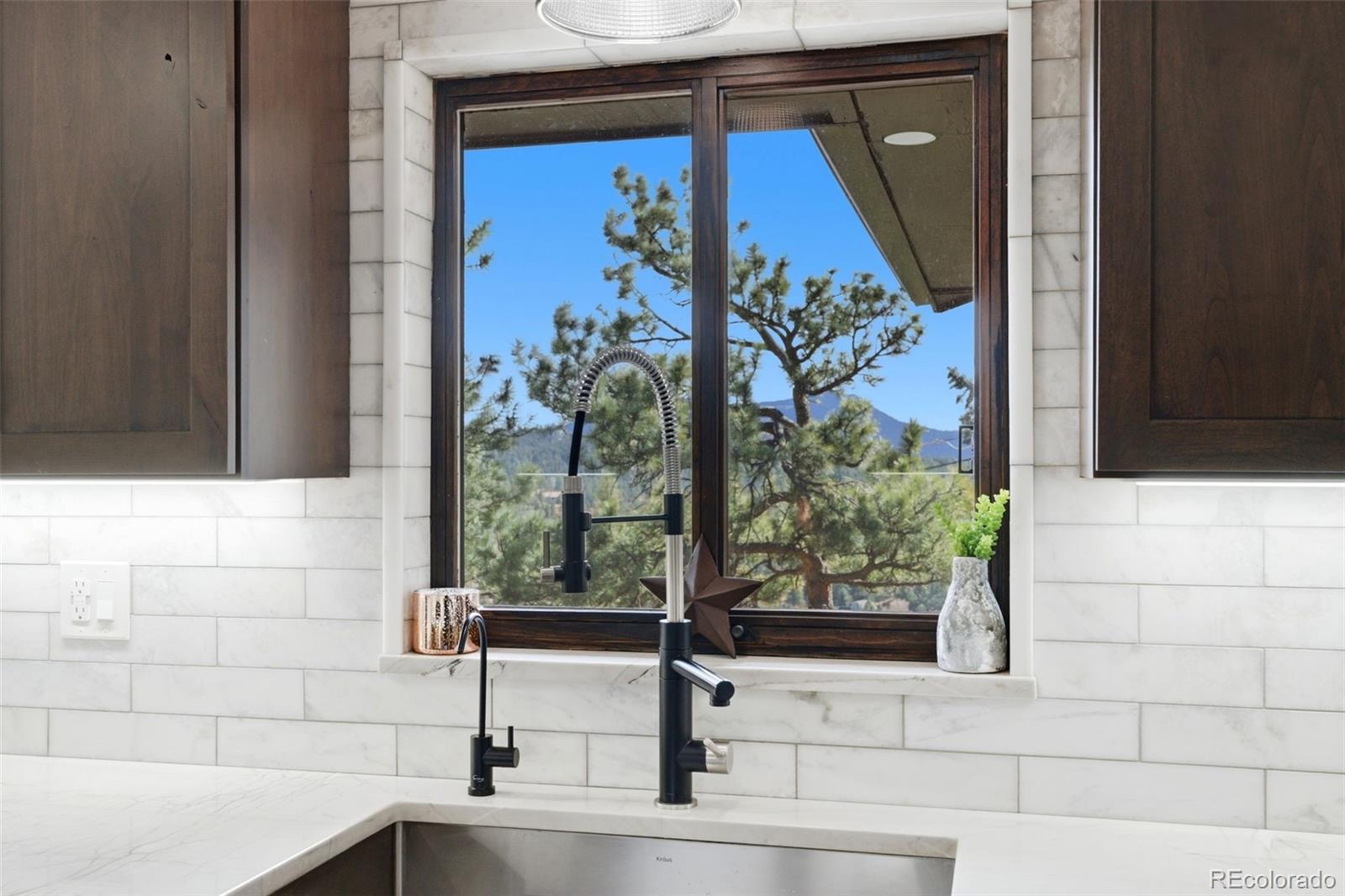 3155 Chestnut Circle Evergreen, CO 80439 - Photo 10 of 50 a bathroom with a sink and a mirror
