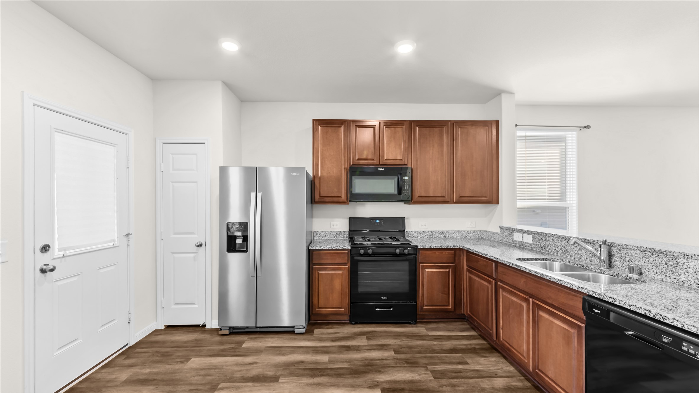 14510 Chasing Bend Drive Houston, TX 77069 - Photo 6 of 22 a kitchen with stainless steel appliances granite countertop a refrigerator and a sink