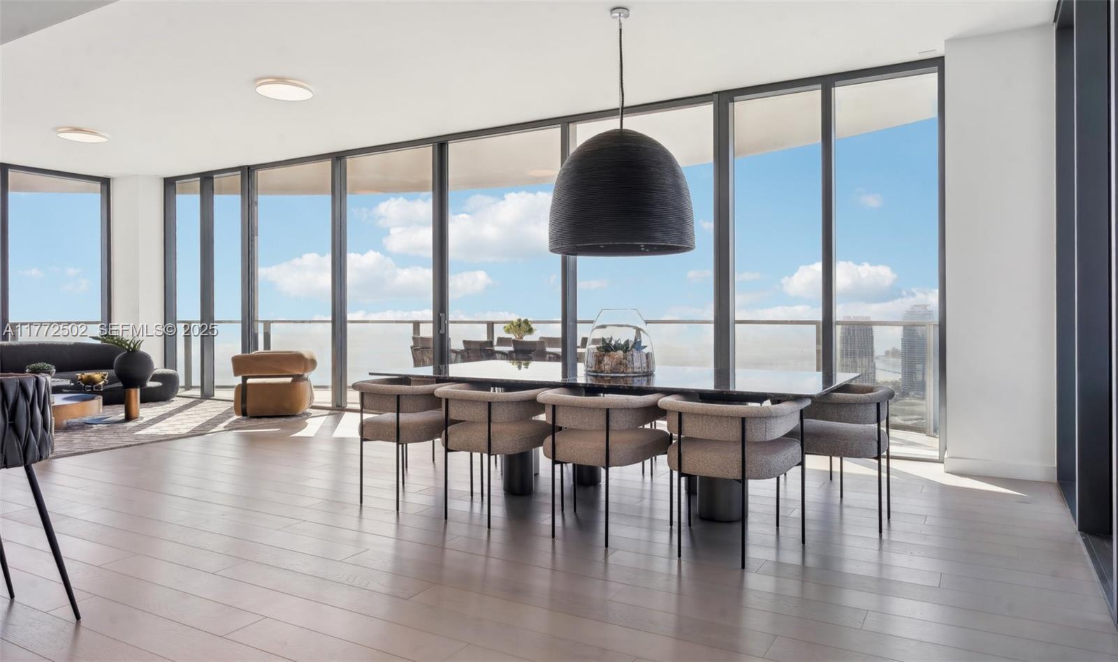 500 Alton Road, Unit 4201 05 Miami Beach, FL 33139 - Photo 12 of 61 a dining room with furniture window and wooden floor
