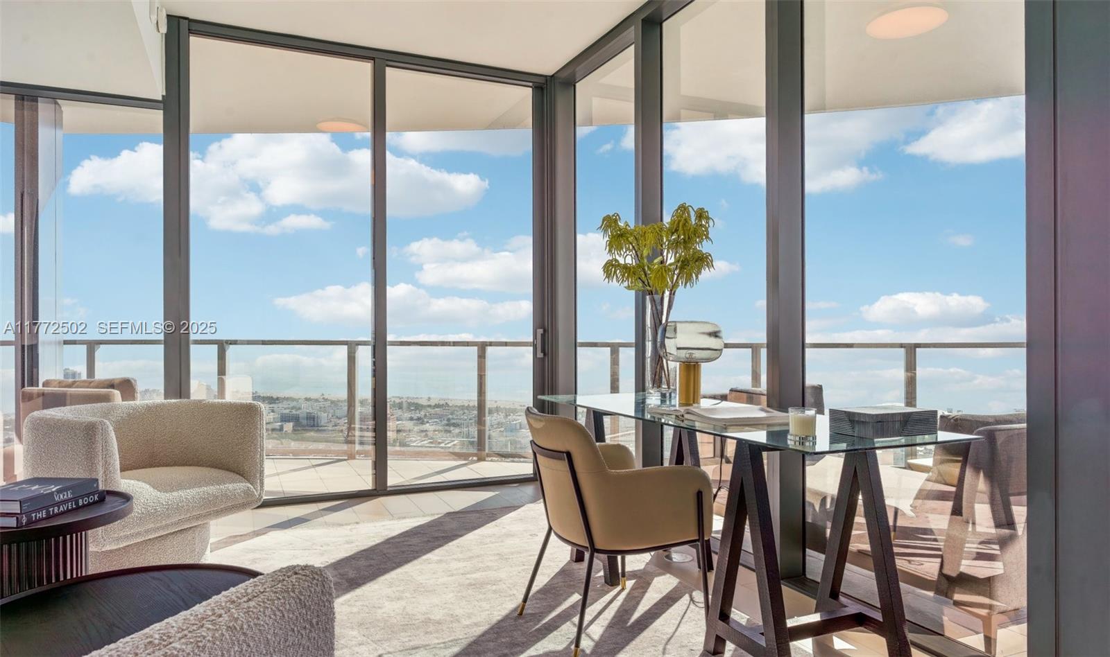500 Alton Road, Unit 4201 05 Miami Beach, FL 33139 - Photo 19 of 61 a dining room with furniture and a floor to ceiling window