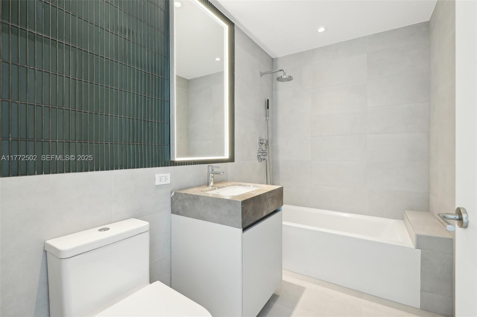 500 Alton Road, Unit 4201 05 Miami Beach, FL 33139 - Photo 22 of 61 a bathroom with a sink a toilet and a bathtub