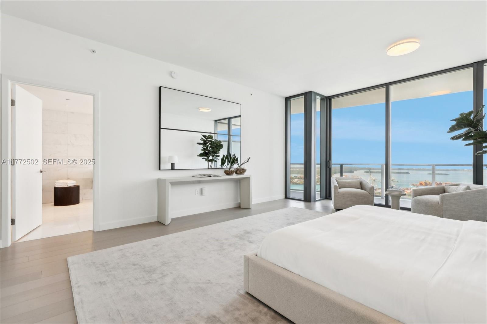 500 Alton Road, Unit 4201 05 Miami Beach, FL 33139 - Photo 42 of 61 a large white bed in a white room