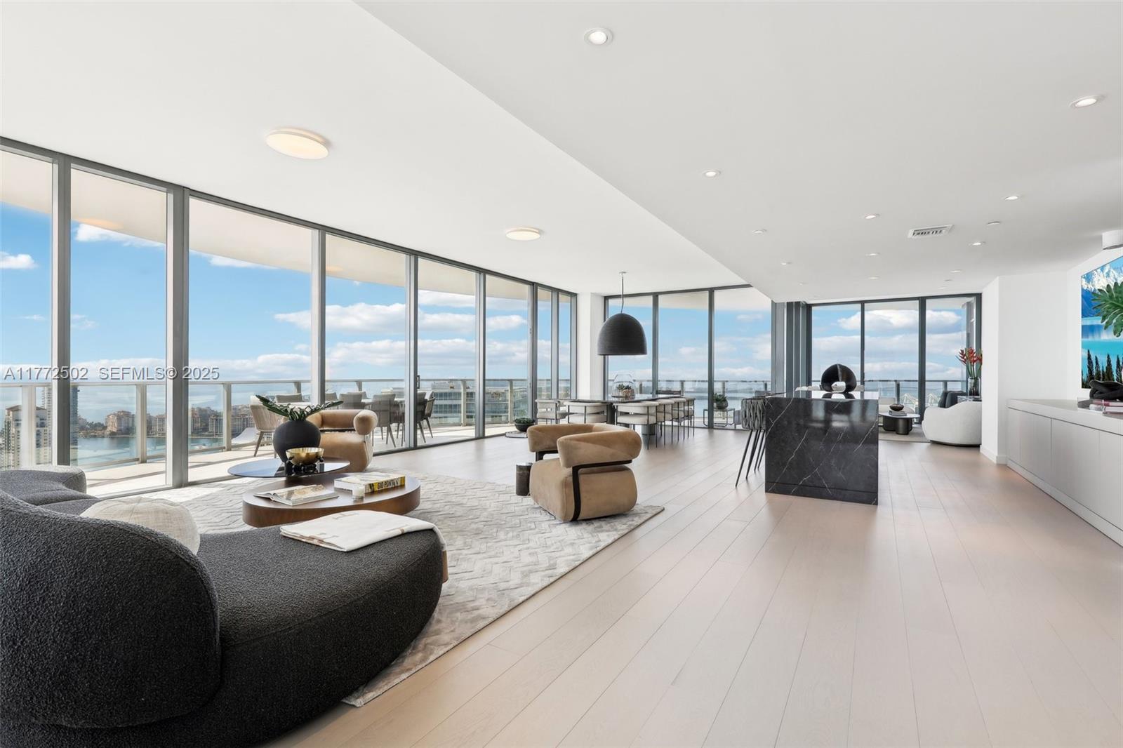 500 Alton Road, Unit 4201 05 Miami Beach, FL 33139 - Photo 6 of 61 a living room with furniture and a large window