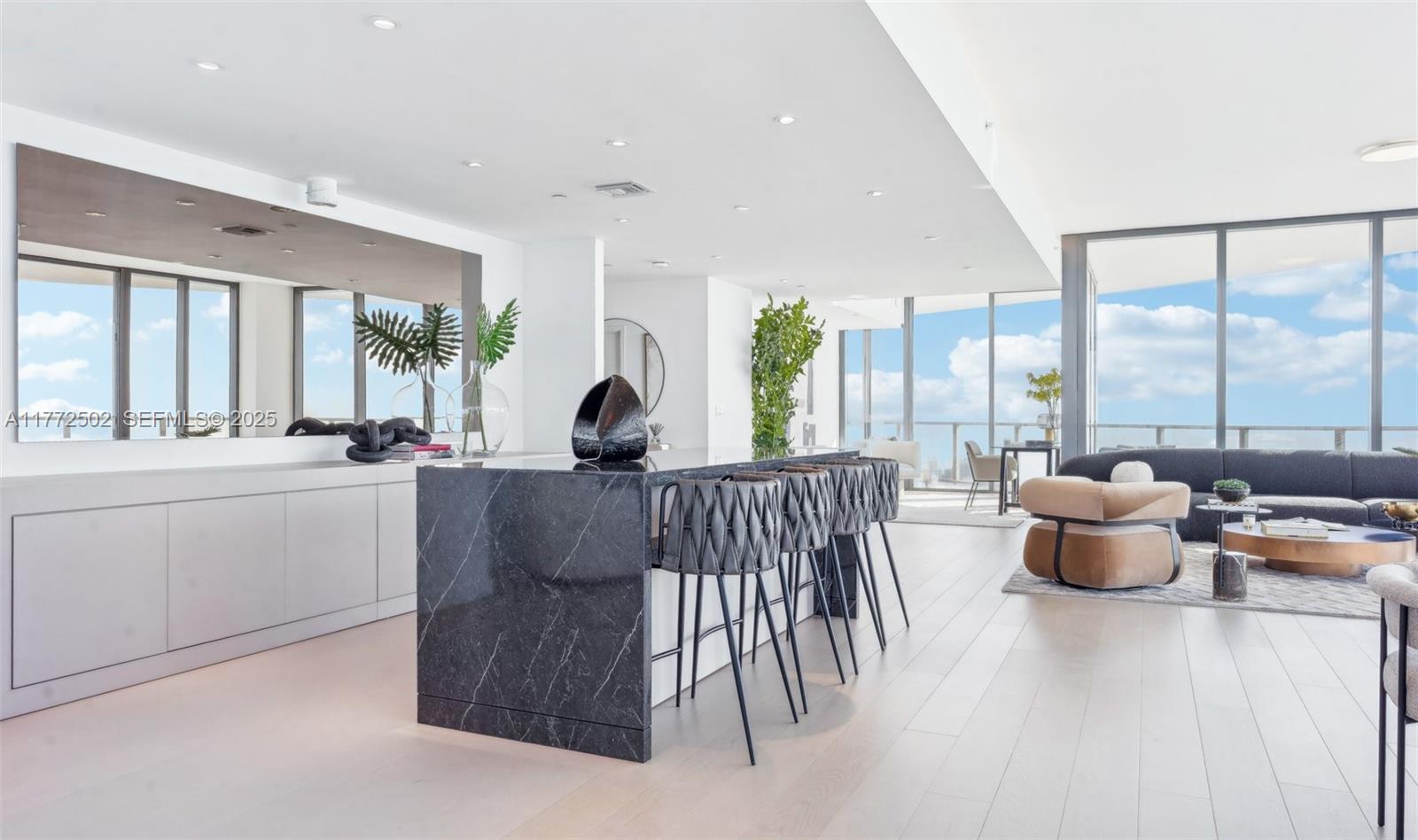500 Alton Road, Unit 4201 05 Miami Beach, FL 33139 - Photo 9 of 61 a living room with furniture and a large window