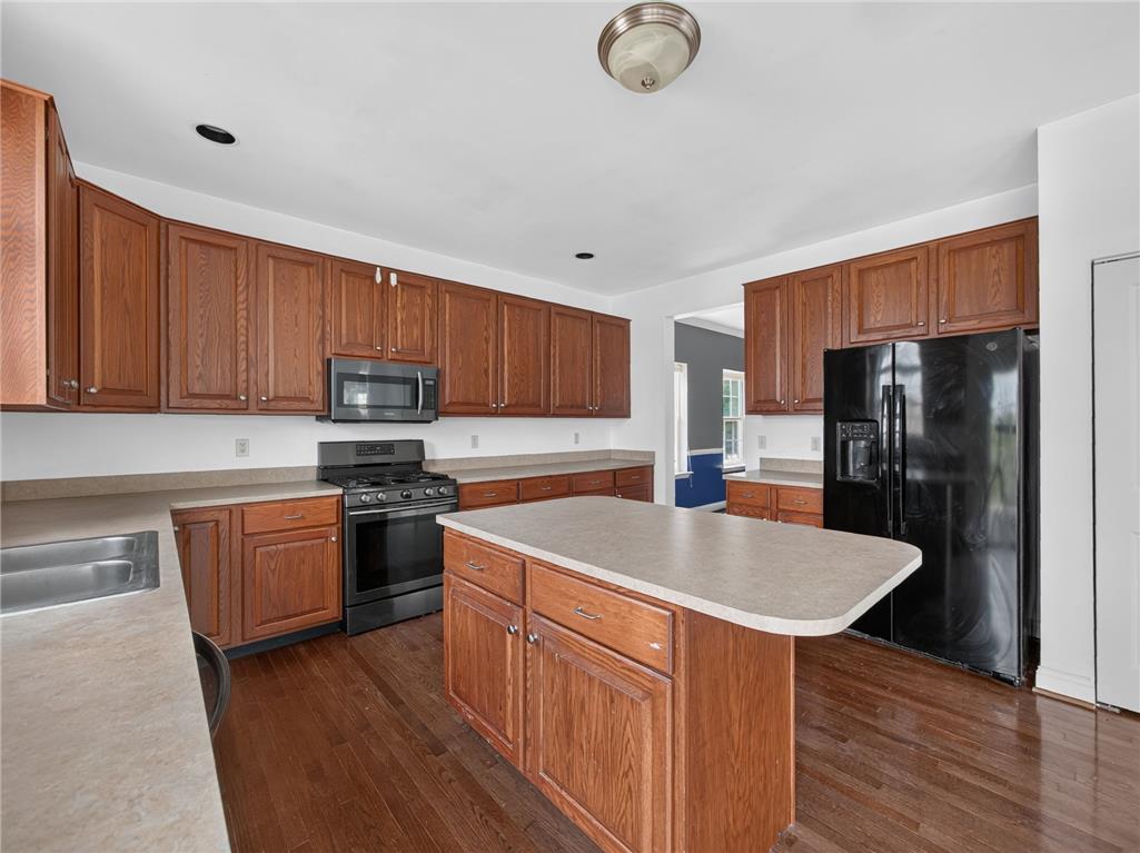 3821 Rittenhouse Road Lower Macungie Township, PA 18062 - Photo 31 of 62 A well-equipped culinary space boasts rich wood cabinetry and a functional central island.