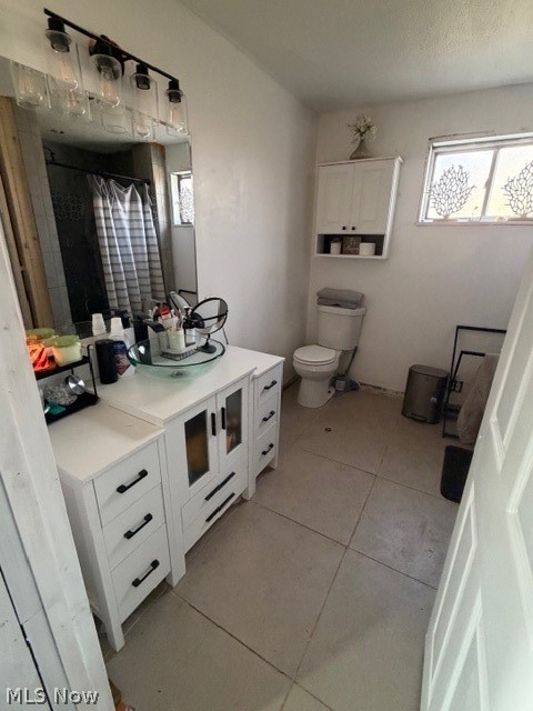 1148 Riverside Avenue Wellsville, OH 43968 - Photo 7 of 14 Bathroom with vanity, light tile patterned floors, plenty of natural light, and a shower with shower curtain