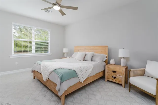 a bedroom with a bed and a couch