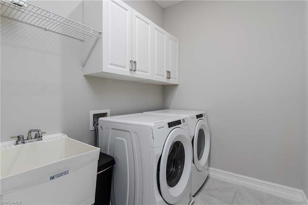 14643 Stillwater Way Naples, FL 34114 - Photo 28 of 50 a utility room with dryer and washer