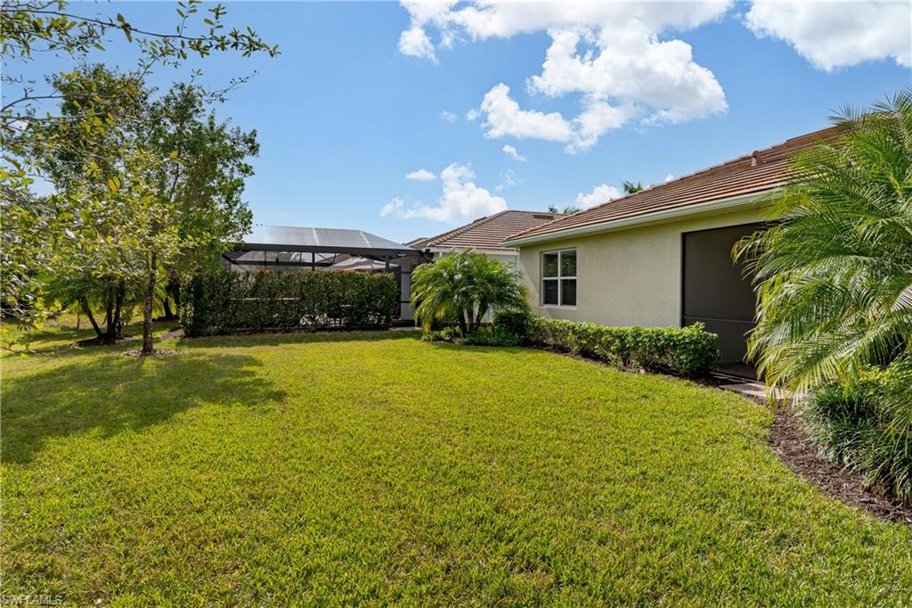 14643 Stillwater Way Naples, FL 34114 - Photo 32 of 50 a view of a house with a yard