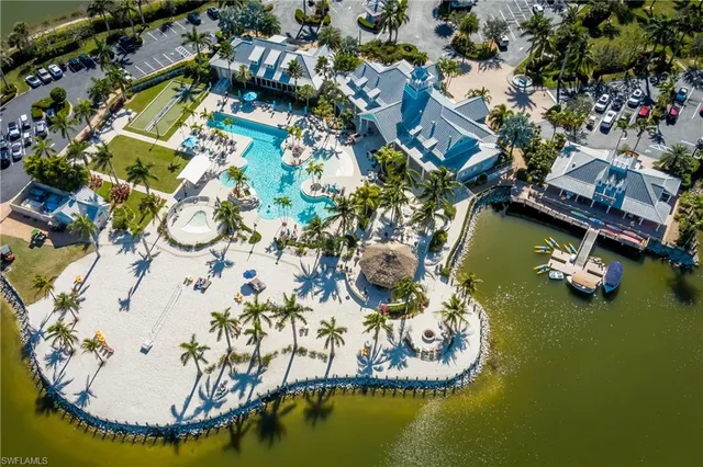 an aerial view of a house with swimming pool and outdoor space