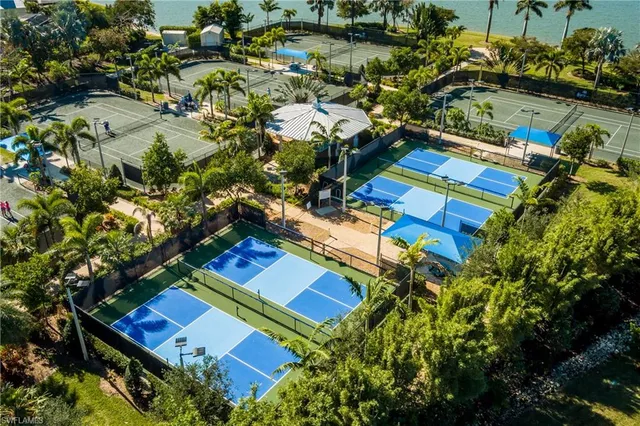 an aerial view of a house with a garden and swimming pool