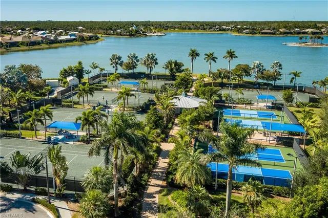 a view of a lake with a table and chairs