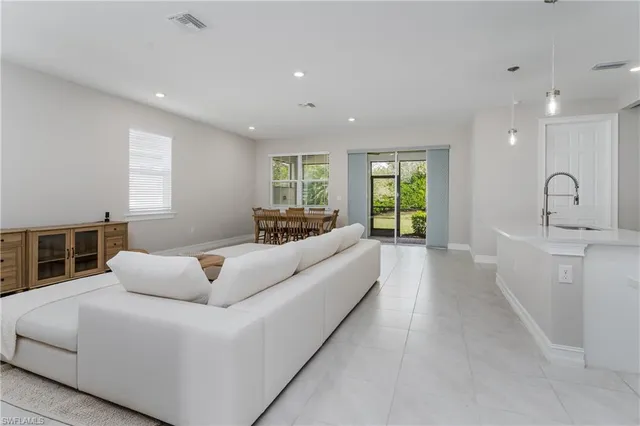 a living room with furniture window and couch