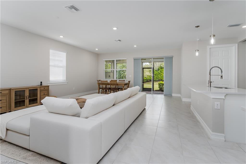 14643 Stillwater Way Naples, FL 34114 - Photo 8 of 50 a living room with furniture window and couch