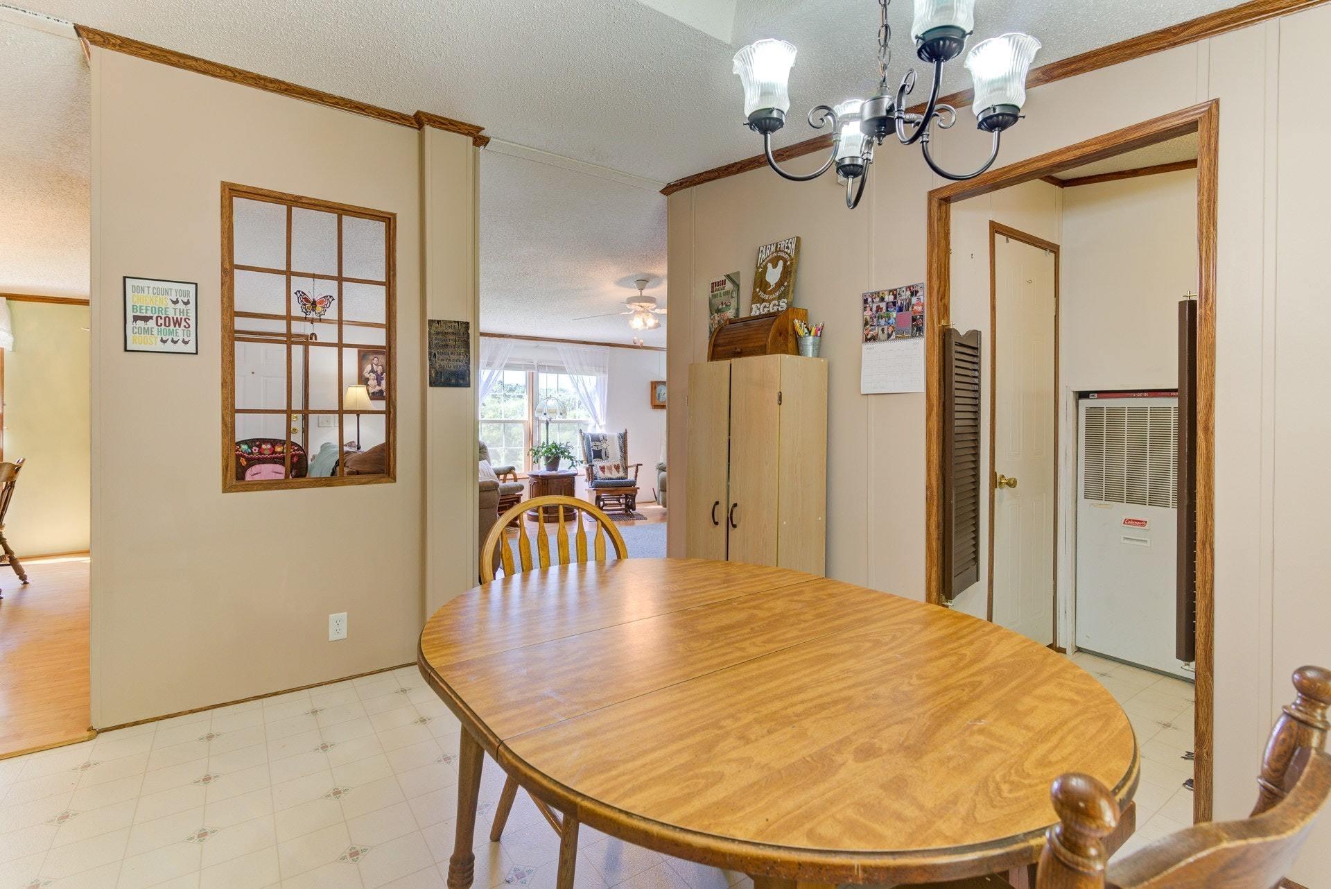 1383 6 Mile Post Road Callaway, VA 24067 - Photo 12 of 30 a view of a dining room with a table and chairs