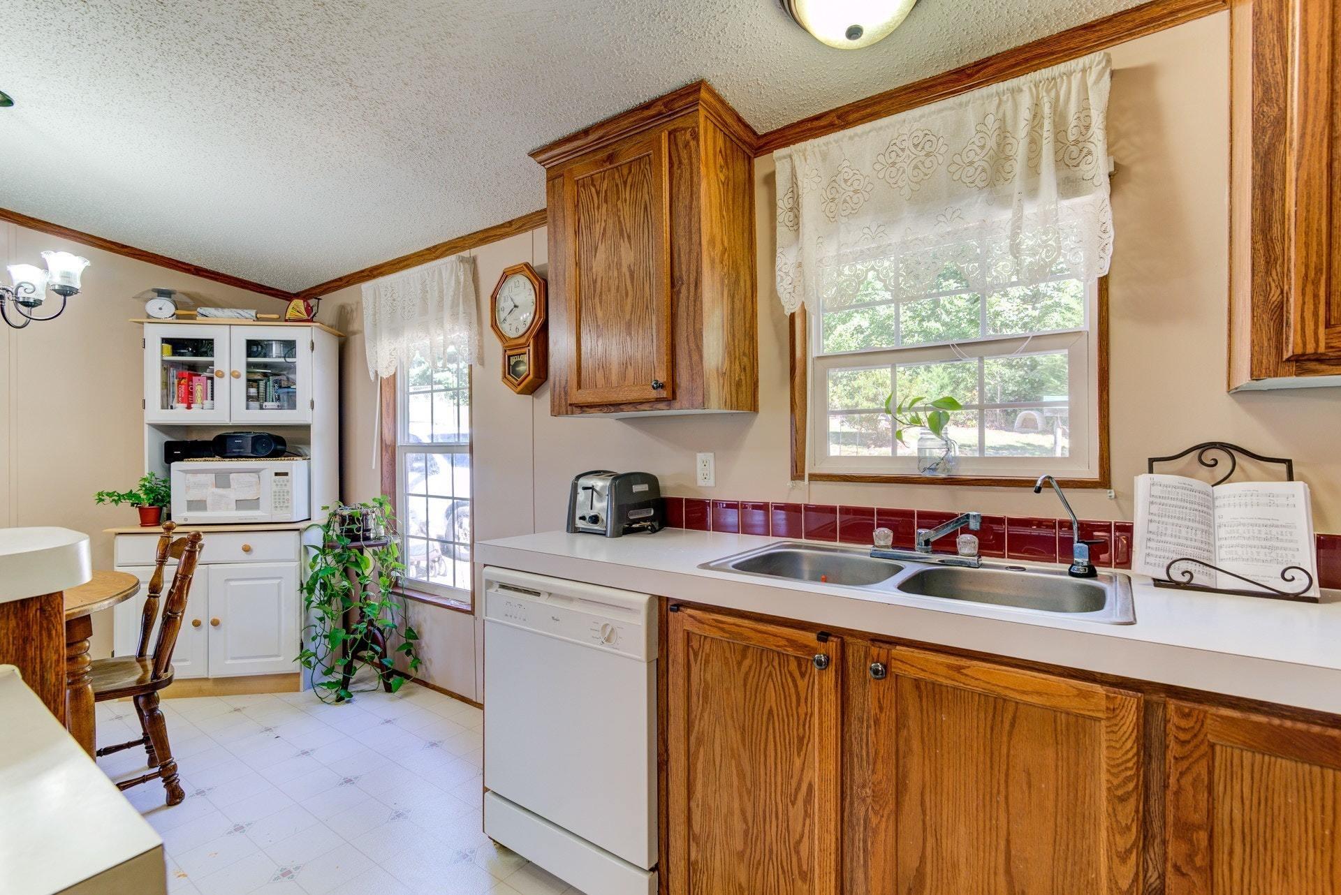 1383 6 Mile Post Road Callaway, VA 24067 - Photo 14 of 30 a kitchen that has a sink and a stove in it
