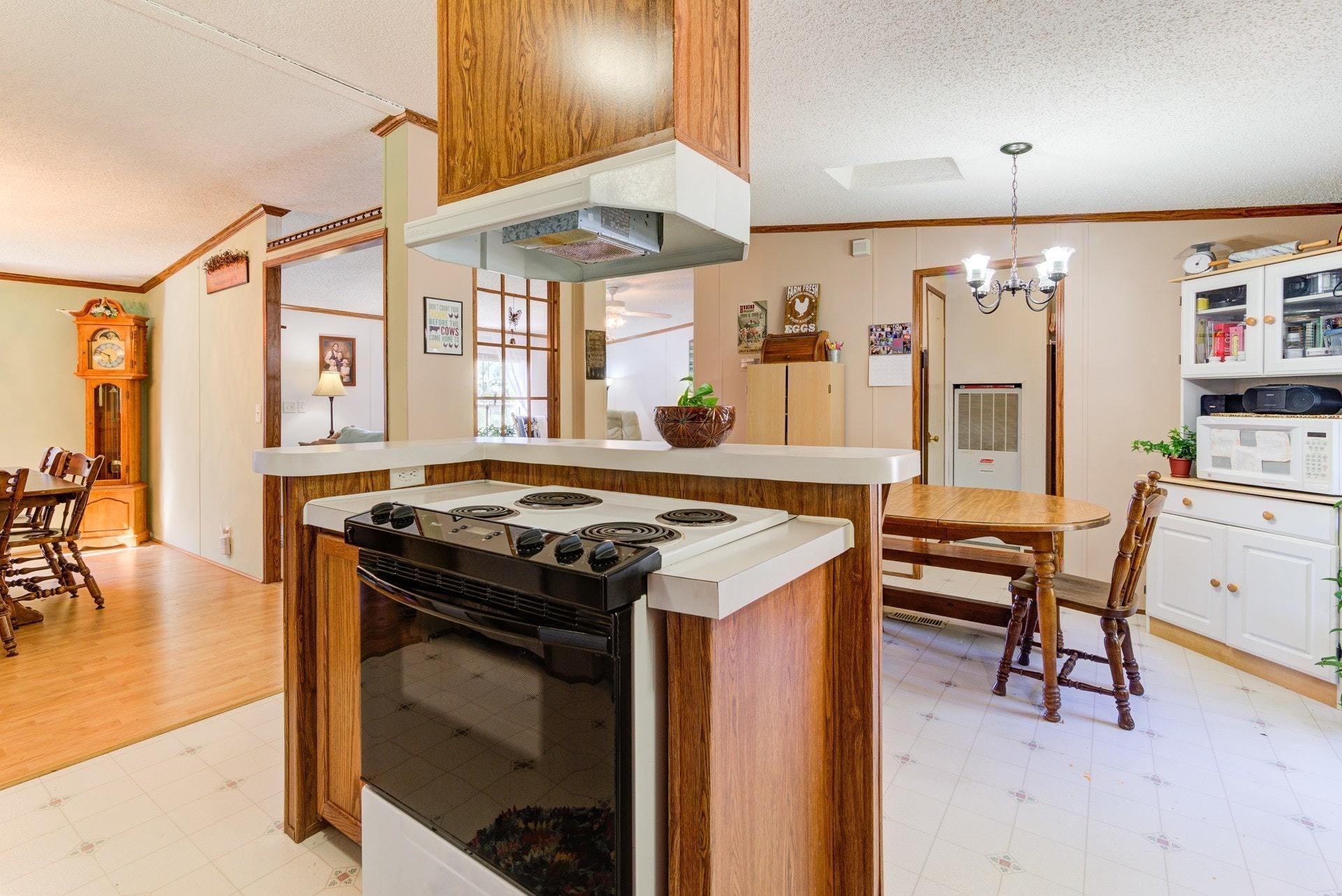1383 6 Mile Post Road Callaway, VA 24067 - Photo 15 of 30 a kitchen that has a stove and a table