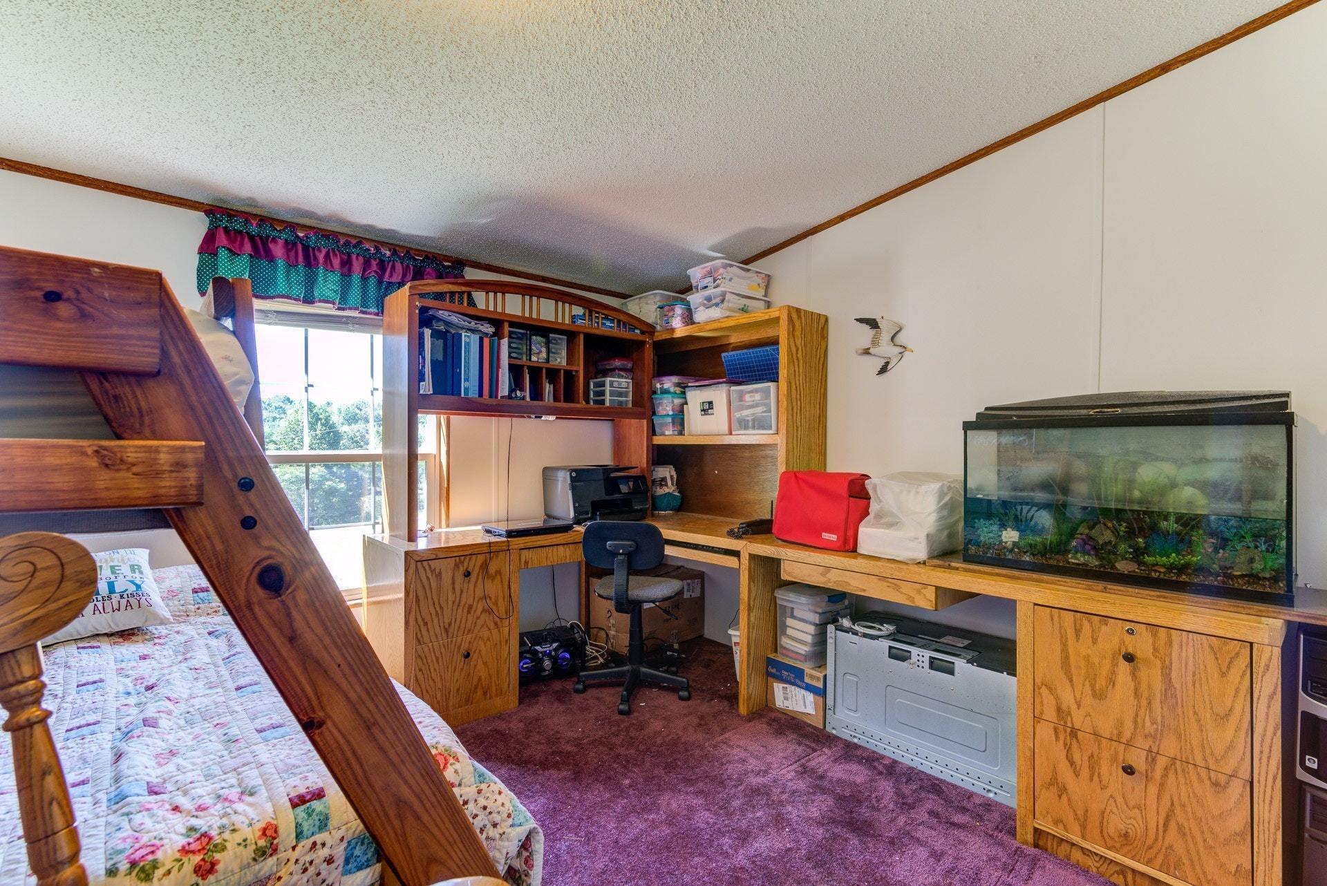 1383 6 Mile Post Road Callaway, VA 24067 - Photo 20 of 30 a living room with furniture and a flat screen tv