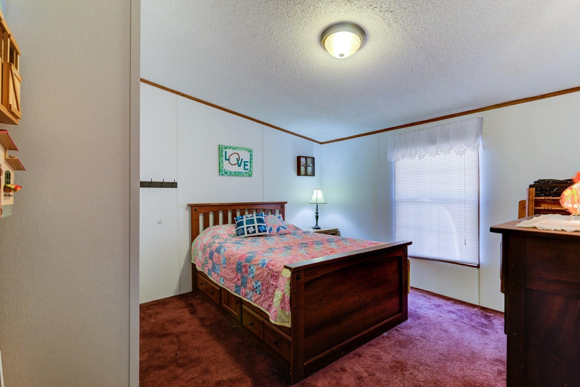 1383 6 Mile Post Road Callaway, VA 24067 - Photo 22 of 30 a bedroom with a bed and a view of kitchen