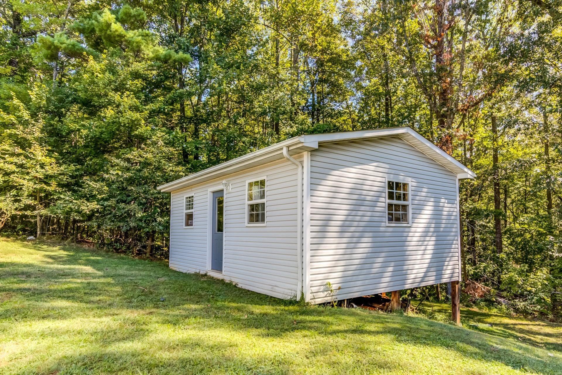 1383 6 Mile Post Road Callaway, VA 24067 - Photo 5 of 30 a view of a backyard with a garden