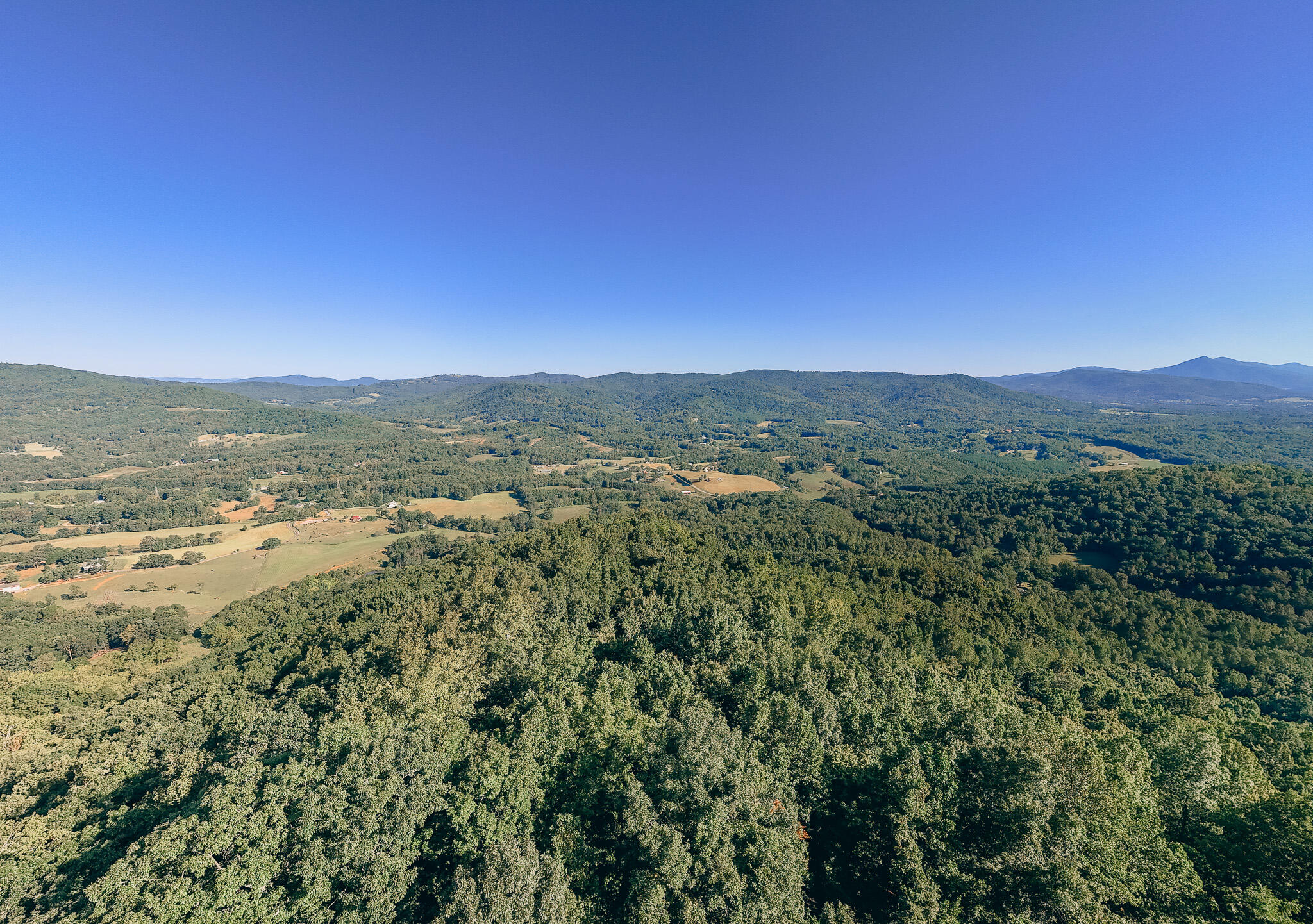 a view of an ocean and a mountain